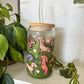 eco friendly cup with dachshund illustrations on a white surface with plants.